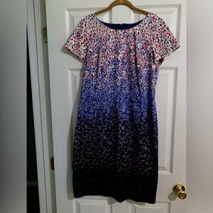 Form fitting, knee length dress.